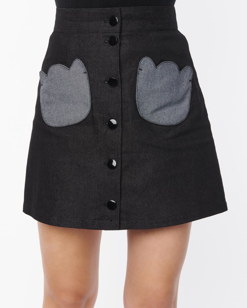 Front of a model wearing a size 4X Smak Parlour Black Denim Tulip Patch Pocket Skirt in Black by Smak Parlour. | dia_product_style_image_id:310031